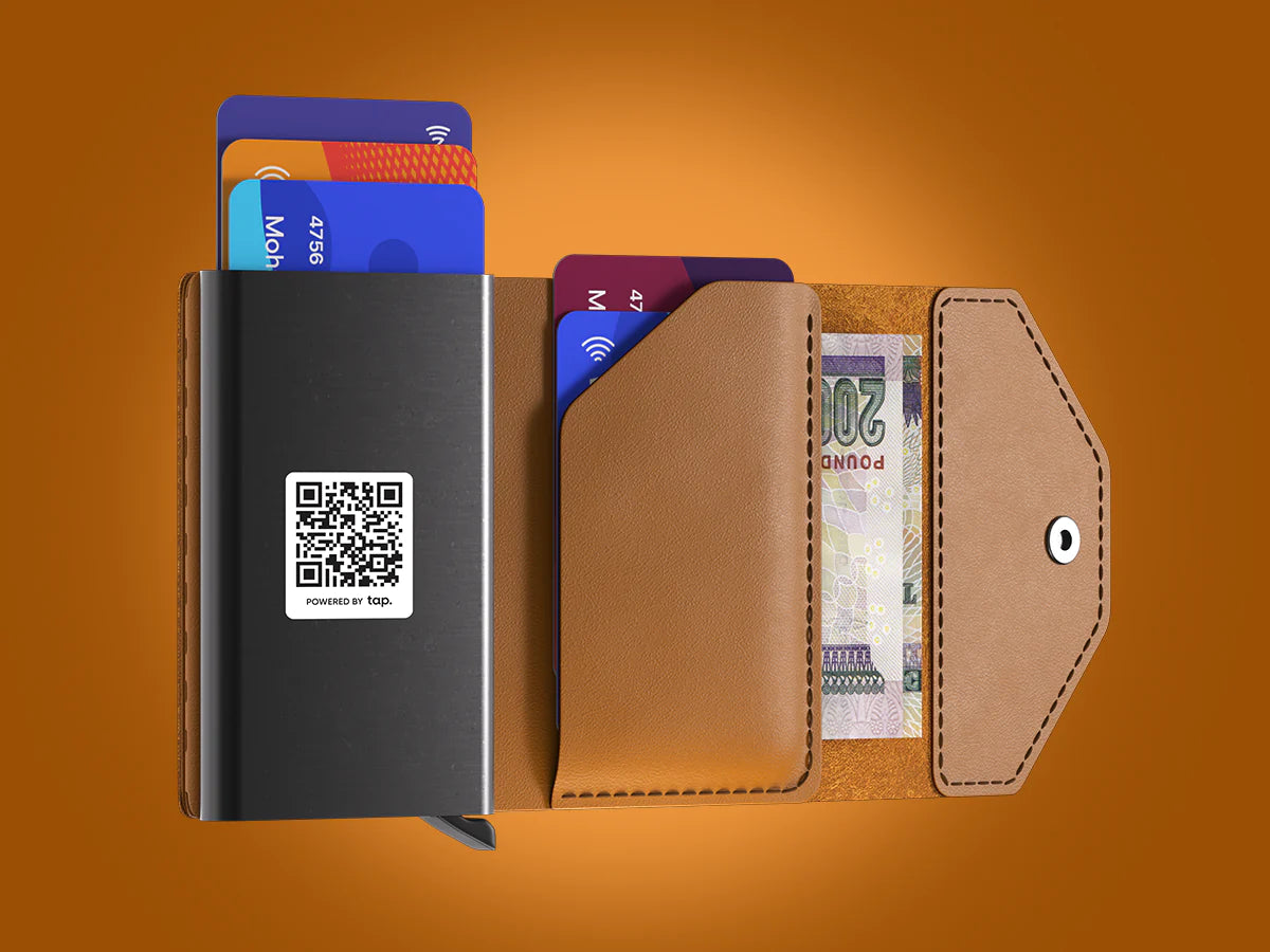 Modern slim leather wallets with credit cards, cash, and QR code against an orange background."