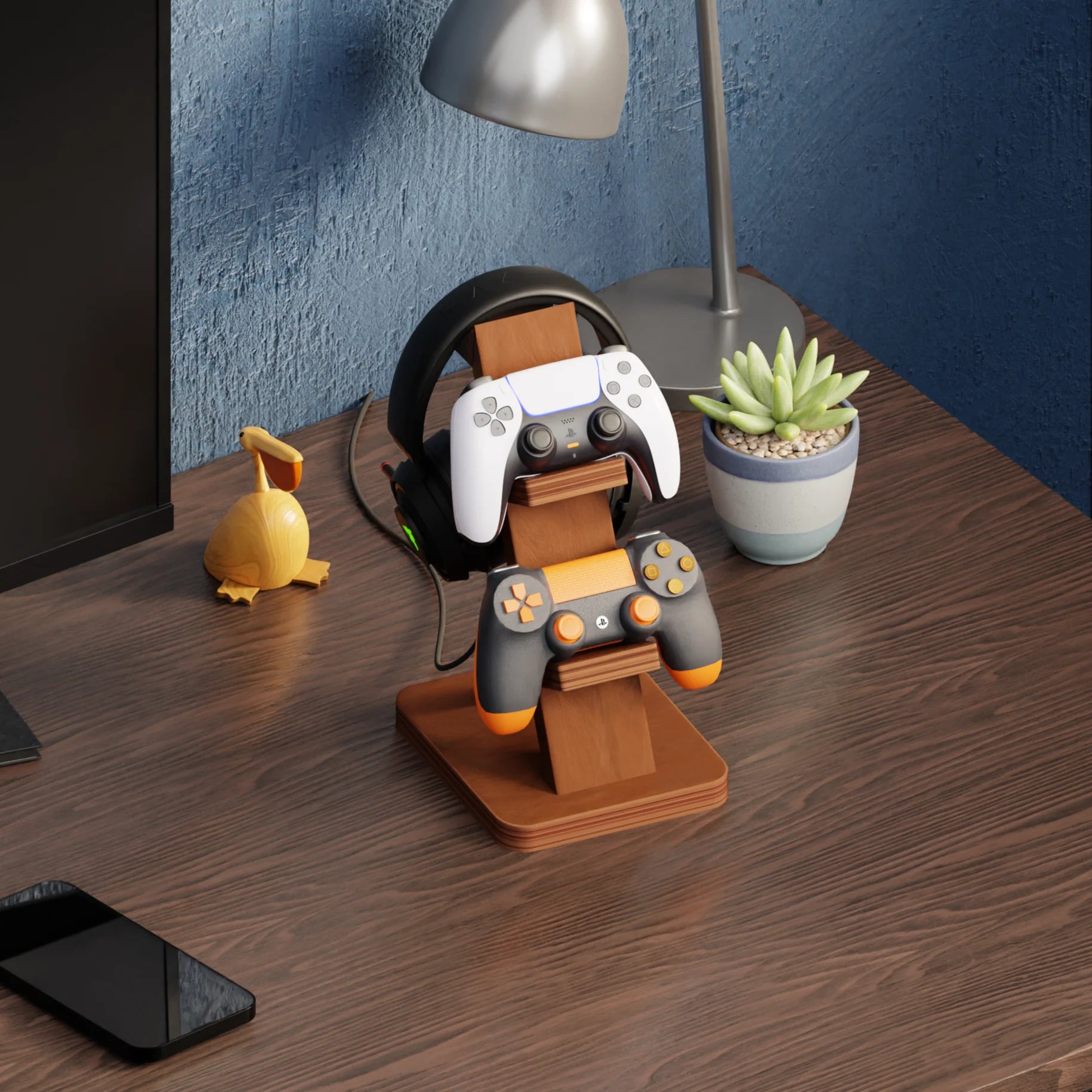 Wooden dual gaming controller stand with a headset stand on a desk.