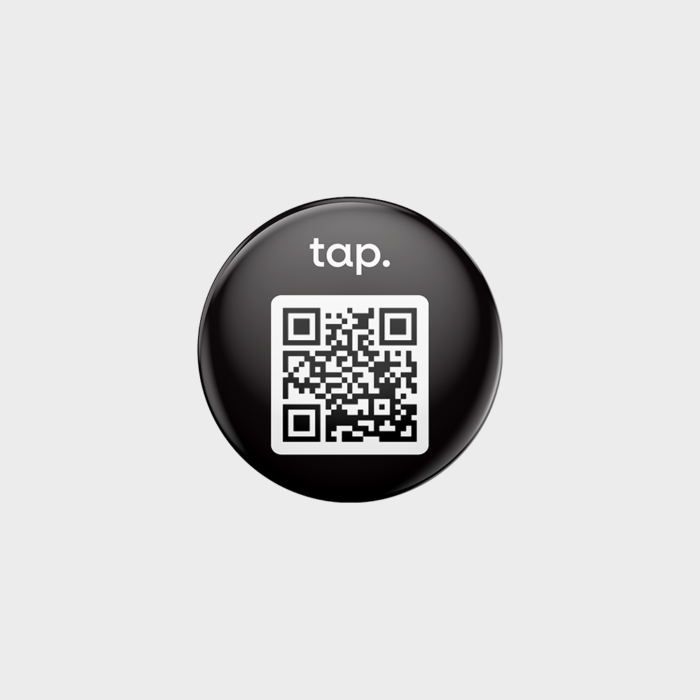 Black circular tap button with QR code for contactless information or payment.