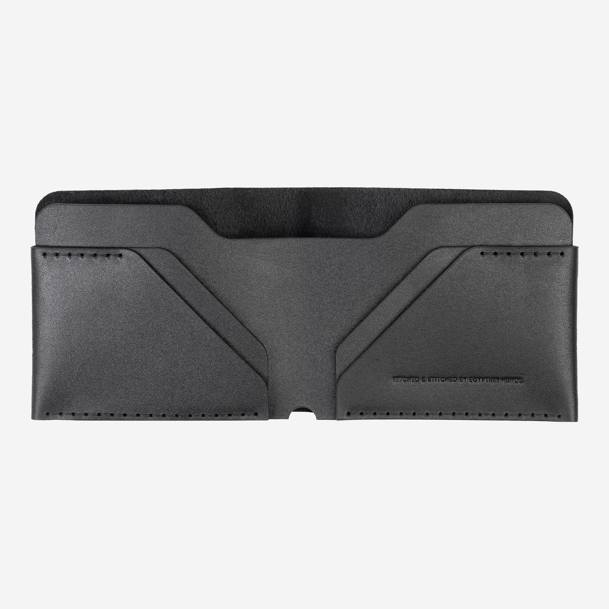 Black leather minimalist bfiold wallet isolated on a white background.