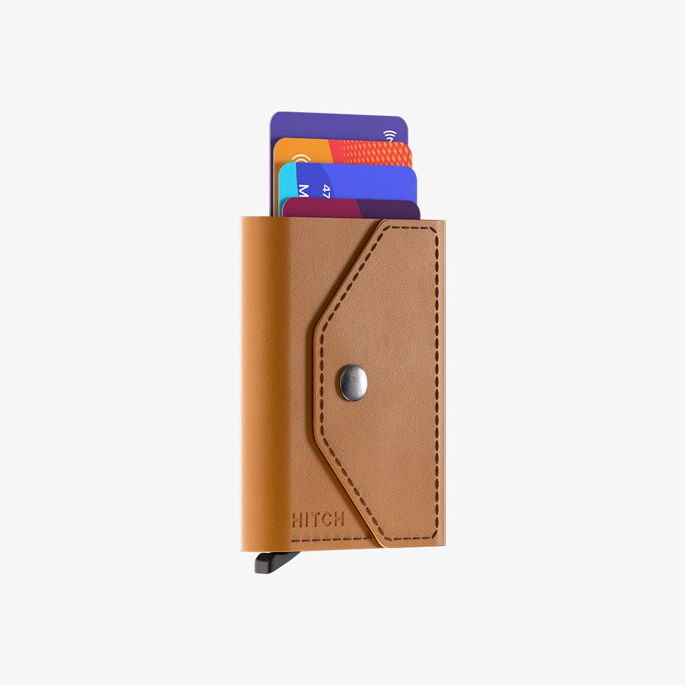 Brown leather wallet with credit cards inside on a white background.