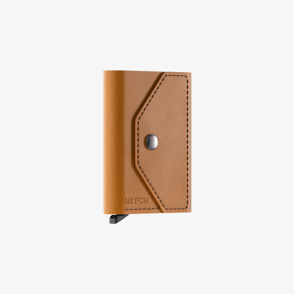 Brown leather wallet with snap closure on a white background.