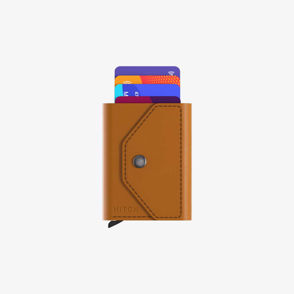 Brown leather card holder with colorful card partially slid out, on a white background.
