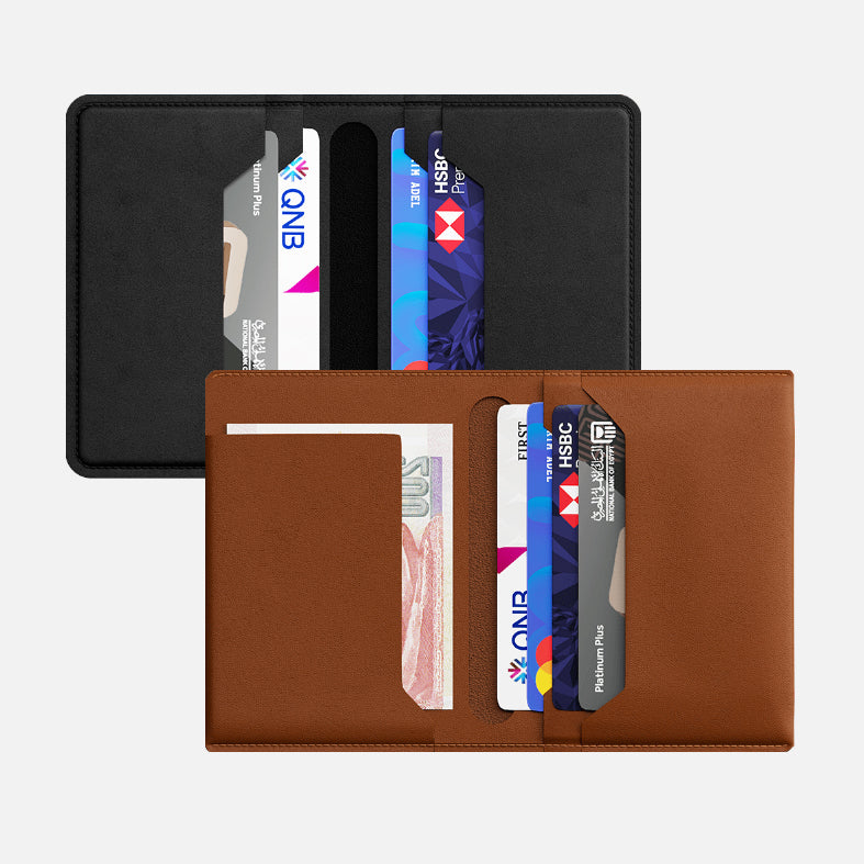 Brown and another black leather bifold wallets with credit cards and cash visible in slots, isolated on a white background.