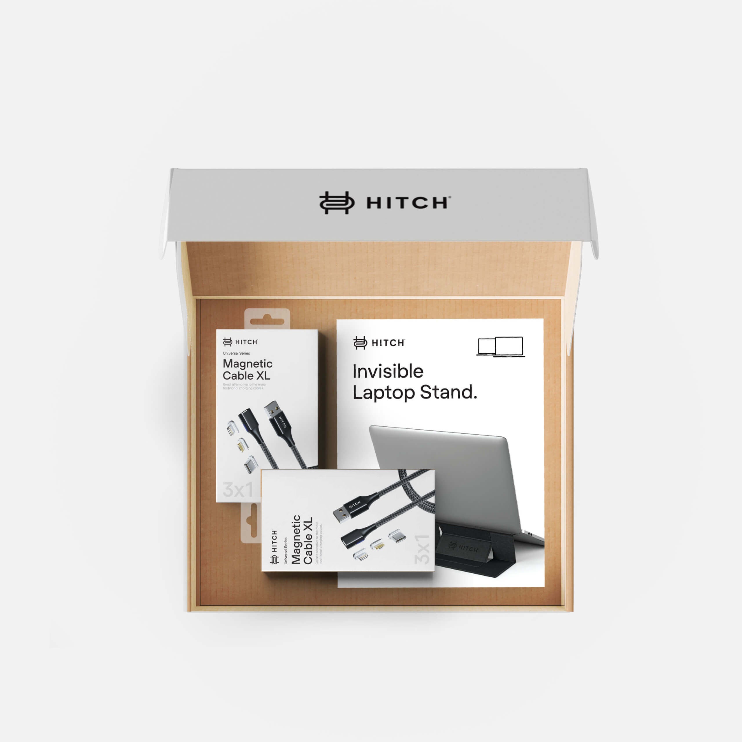 "Open HITCH brand packaging box with magnetic cable and invisible laptop stand inside, showcasing product design."