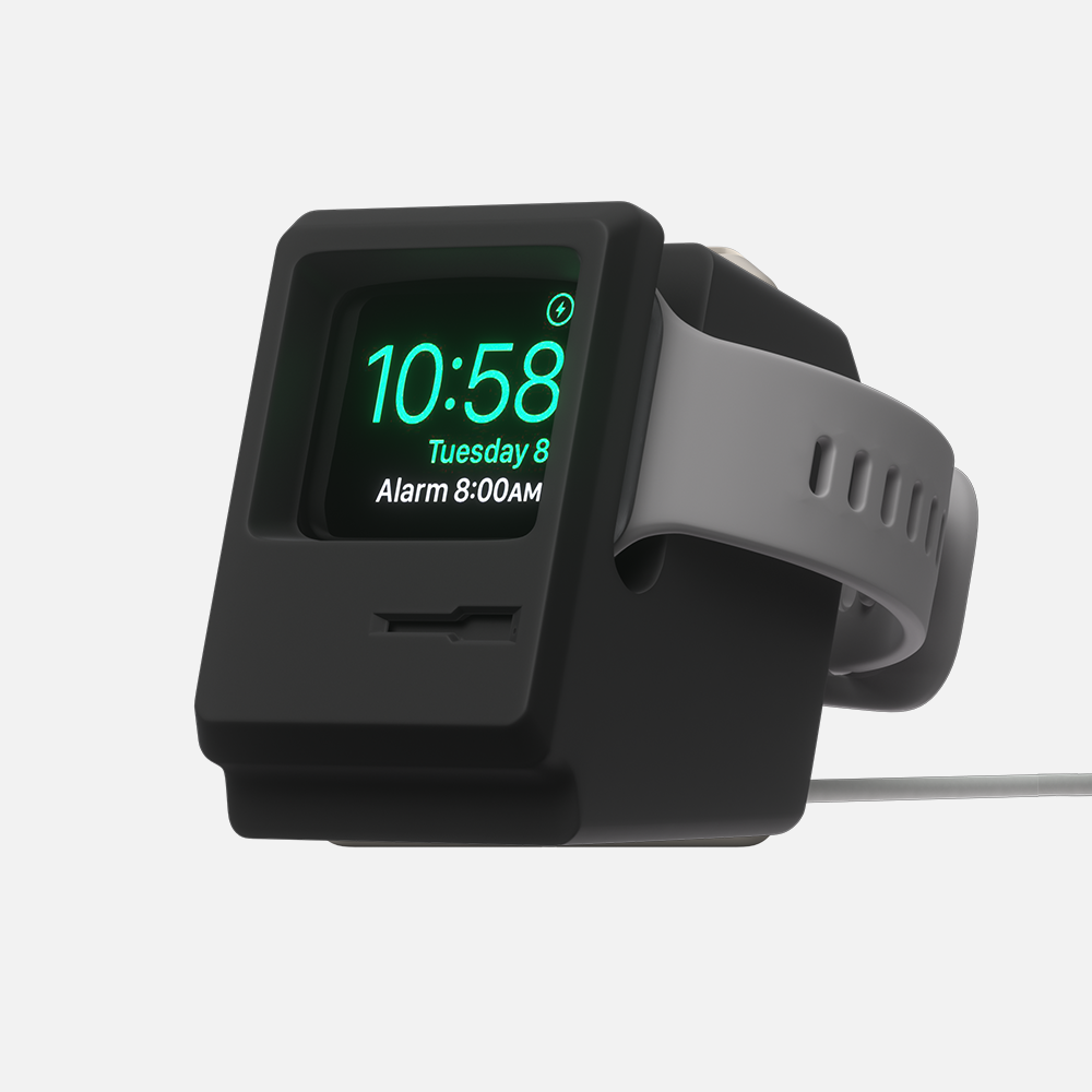 Black Macintosh Apple smartwatch stand with green digital display showing time and date on a white background.