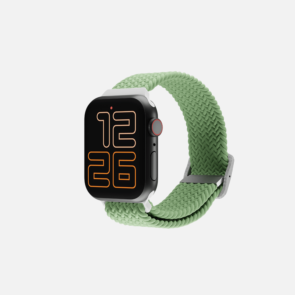 Smartwatch with green braided loop band displaying time on a white background.