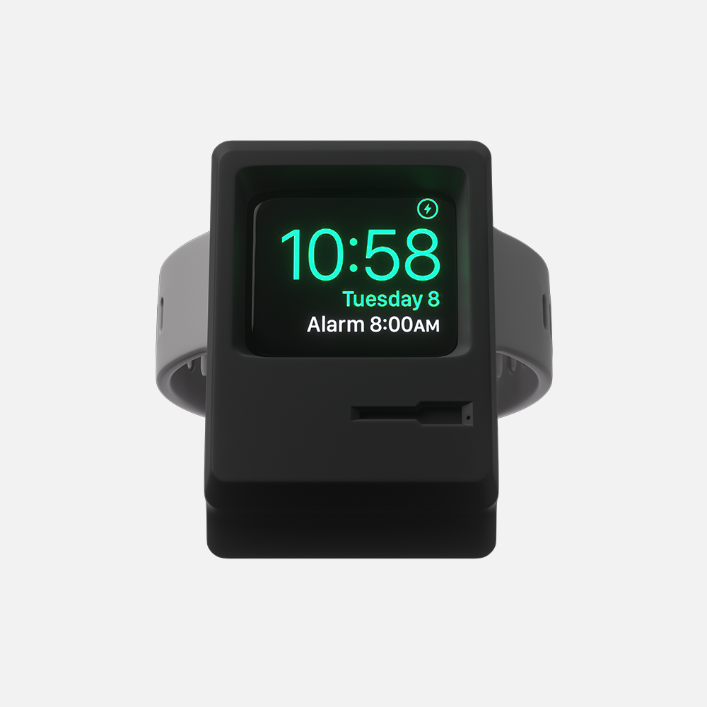 Black Macintosh Apple smartwatch stand showing time and date with alarm notification on display.