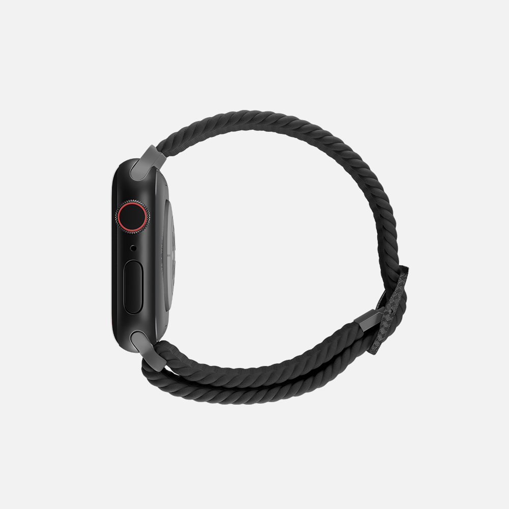 Black smartwatch with braided loop band and red-accented digital crown on white background.