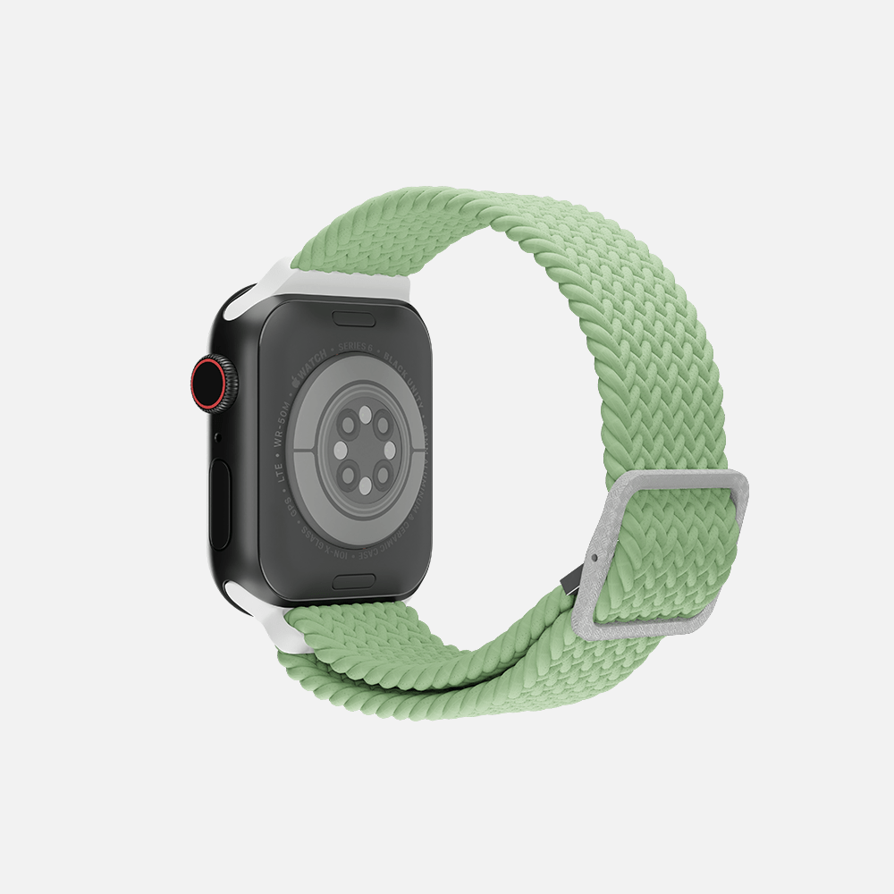 Rear view green braided loop smartwatch with red digital crown on a white background.