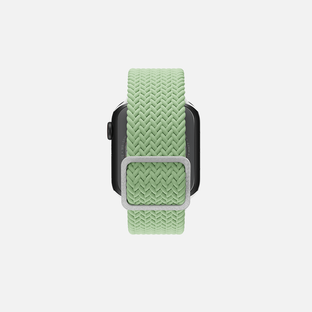 Green braided solo loop band on smartwatch isolated on white background from the back