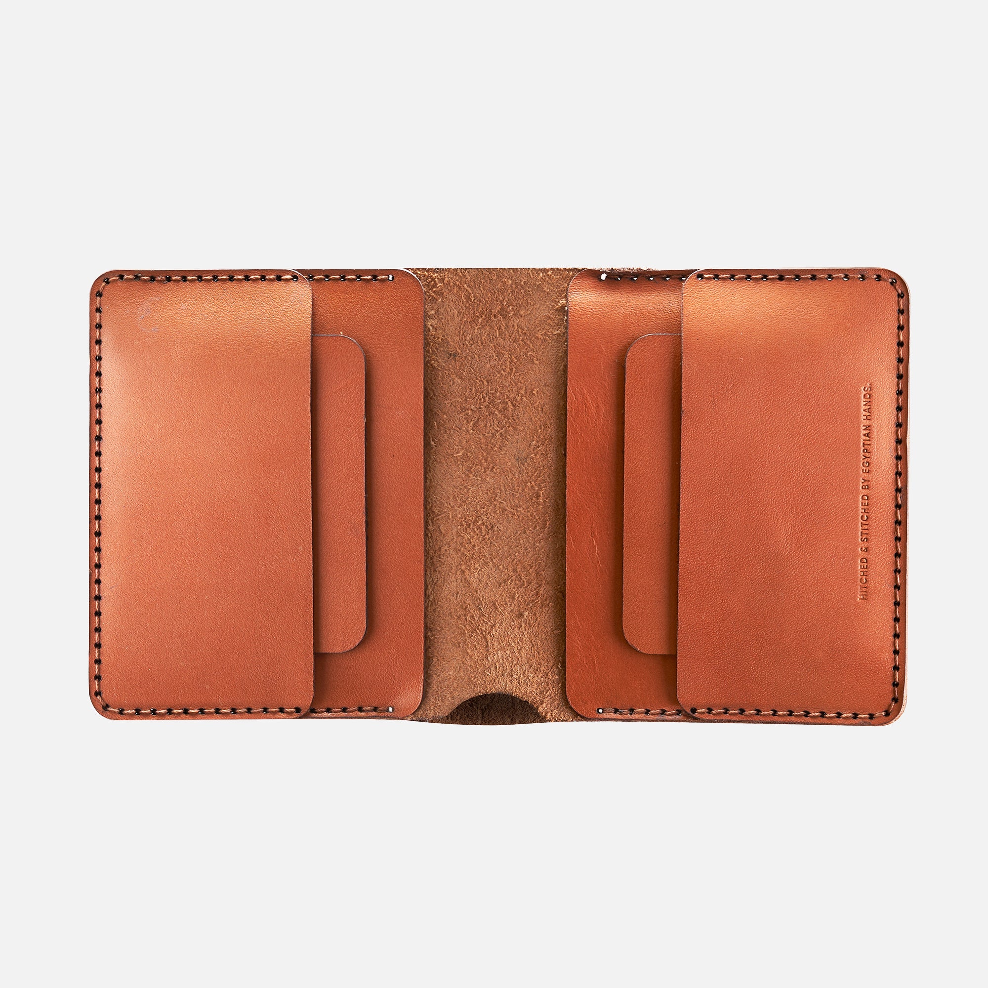Open brown leather bifold wallet showing card slots, top stitch detailing, isolated on a white background.