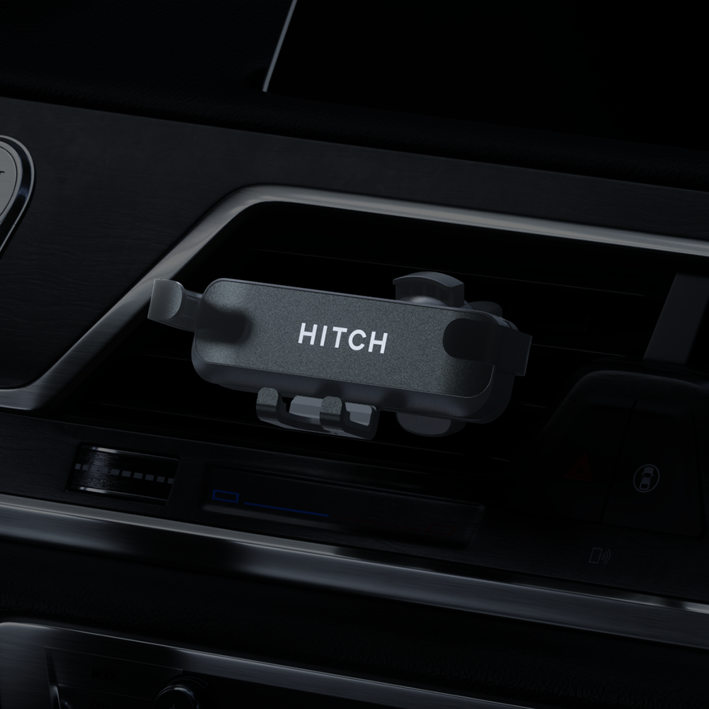 Close-up of a vehicle hitch controller with 'HITCH' text, inside a modern car interior.