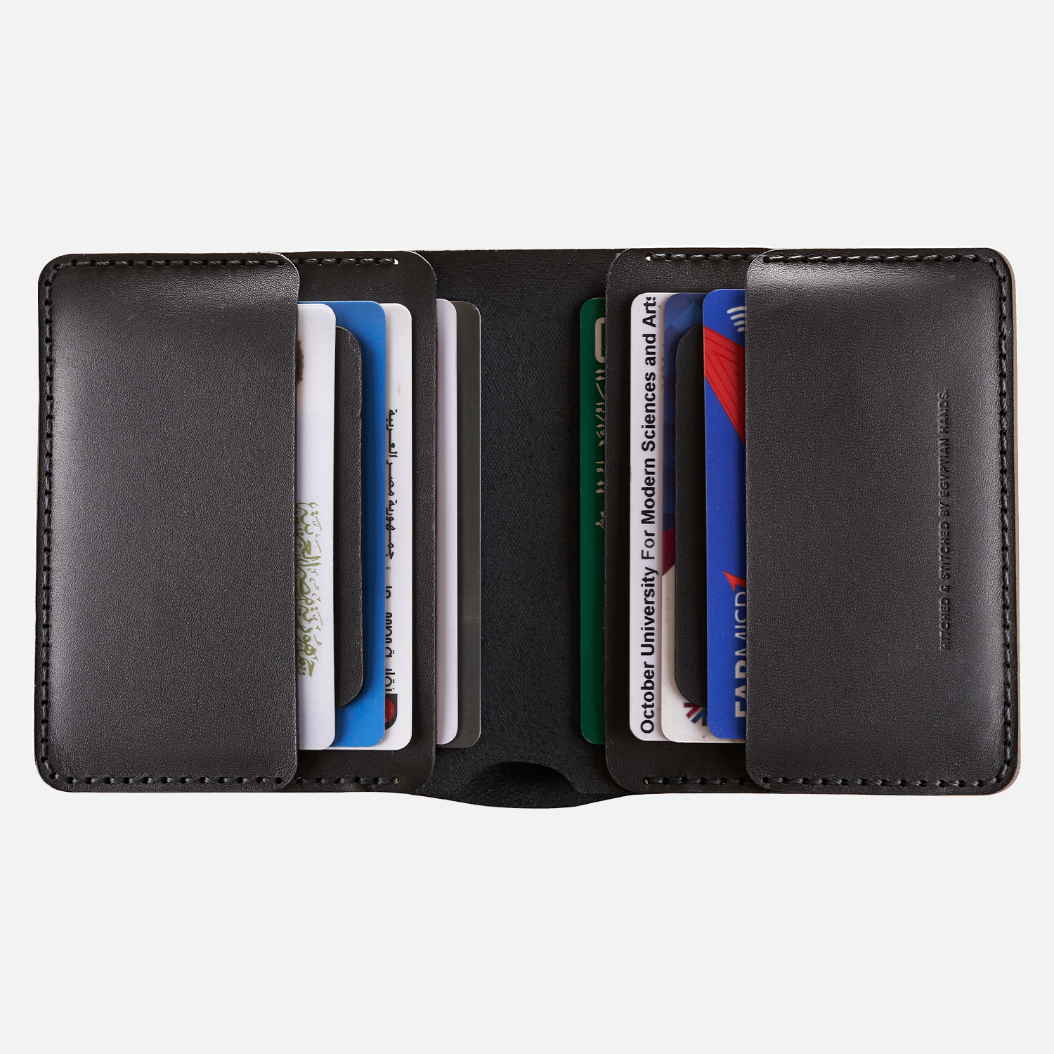 Black leather bifold wallet with multiple credit cards and ID cards displayed inside.