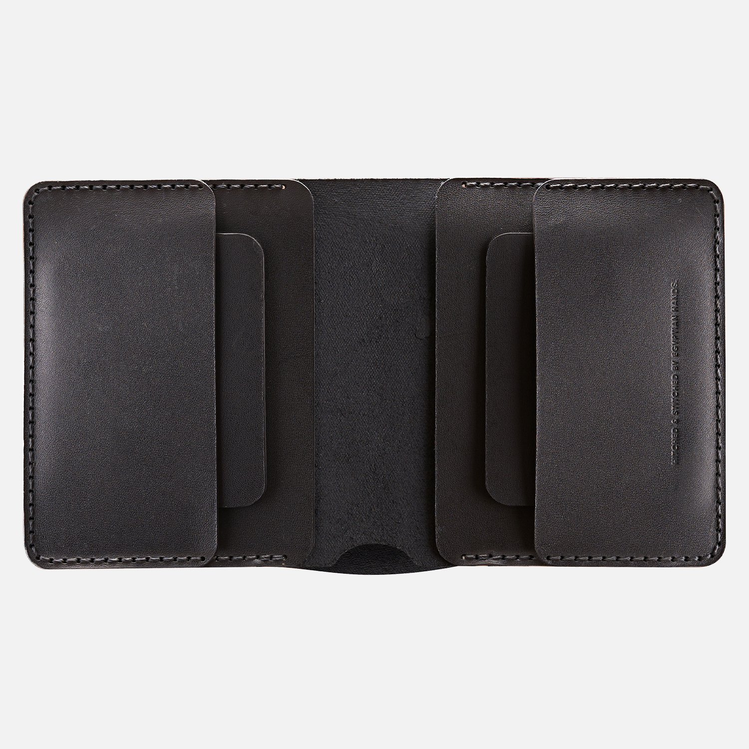 Open black leather bifold wallet showing card slots, isolated on a white background.