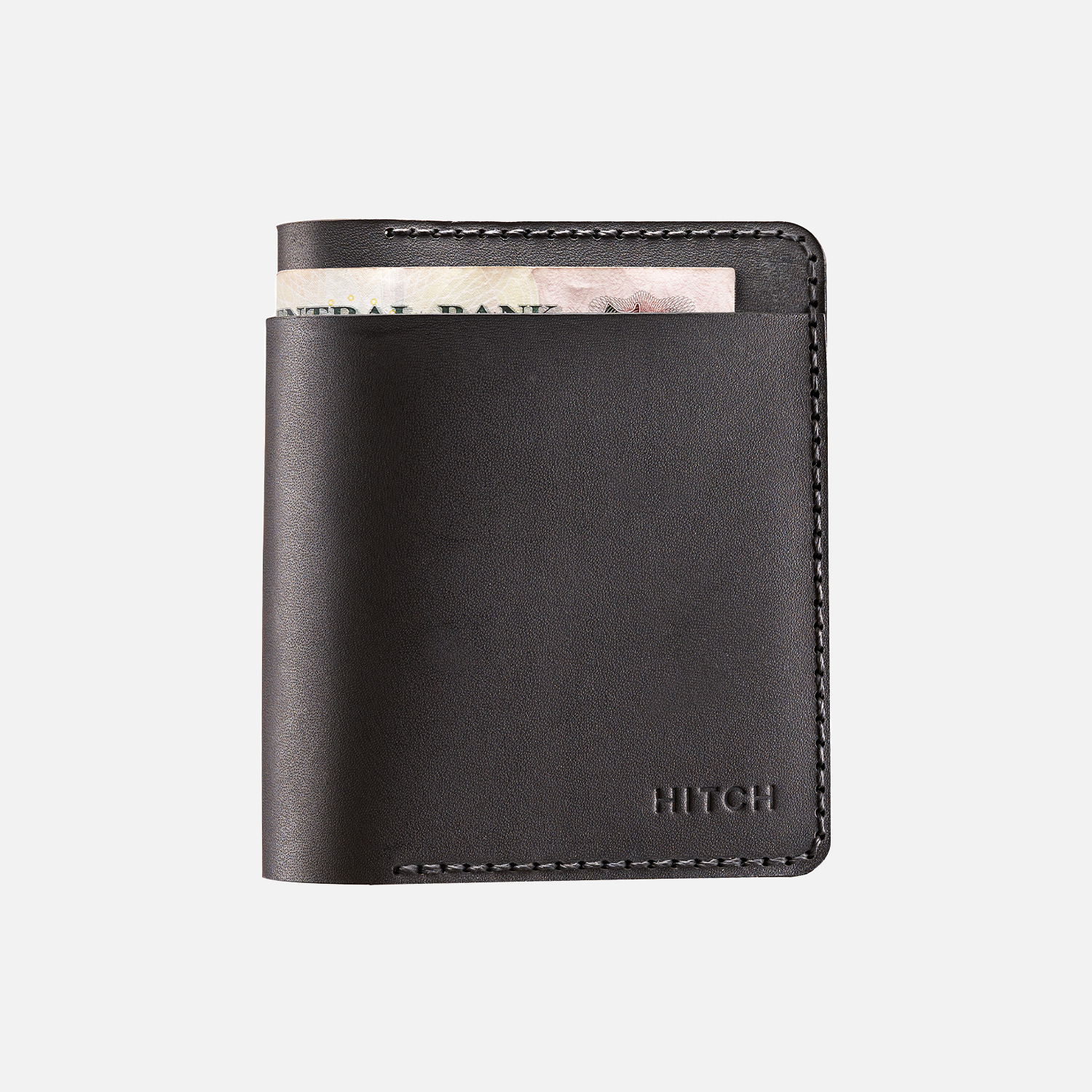 Black leather bifold wallet with cash peeking out and 'HITCH' branding on a white background.