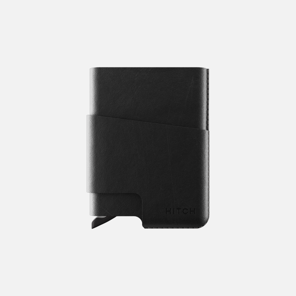 Black leather minimalist wallet isolated on white background.
