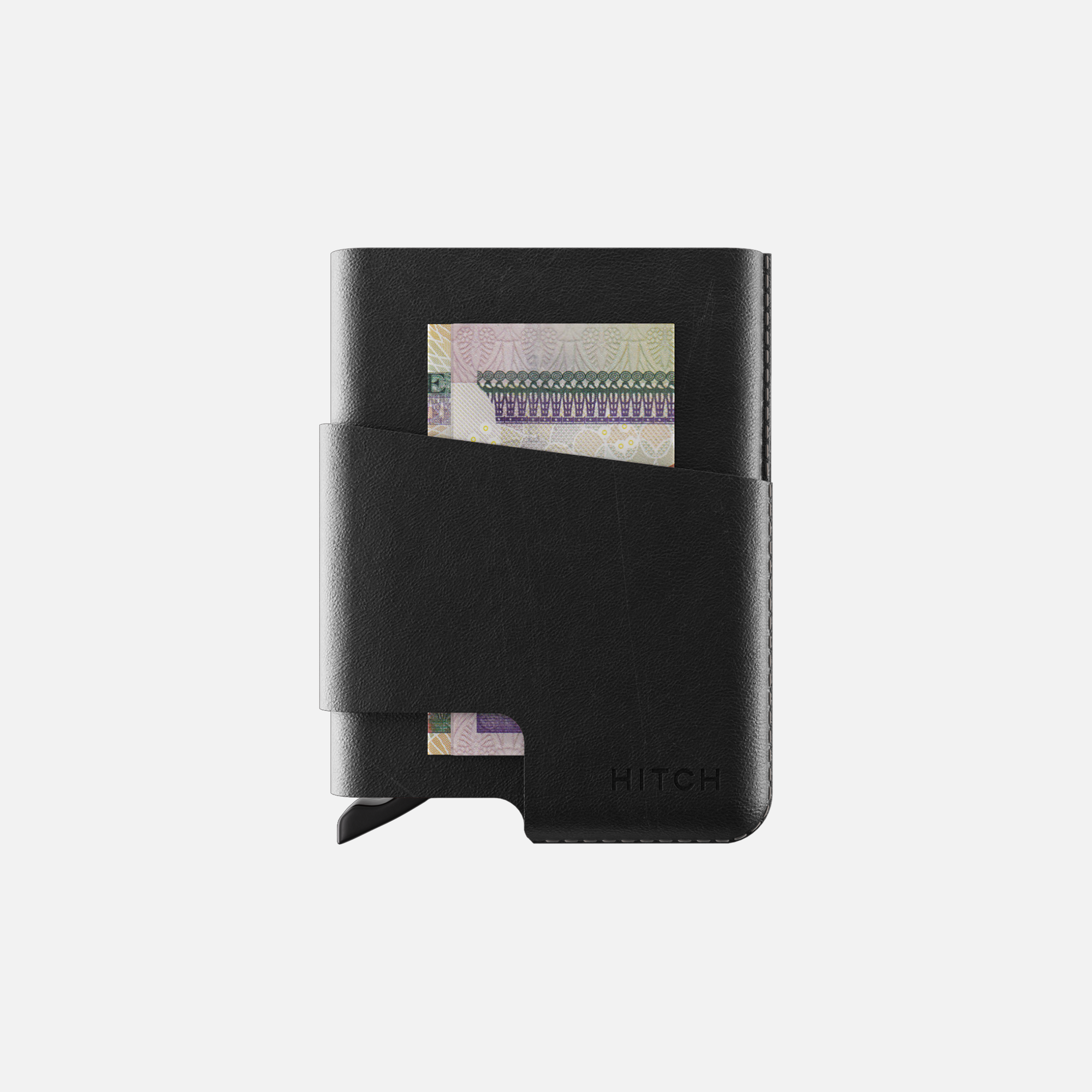 Black wallet with money clip and Egyptian currency note.