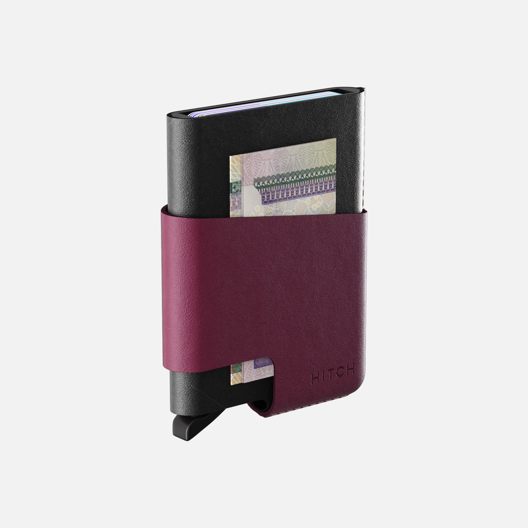 Minimalist black and burgundy leather wallet with money clip and card storage on white background."