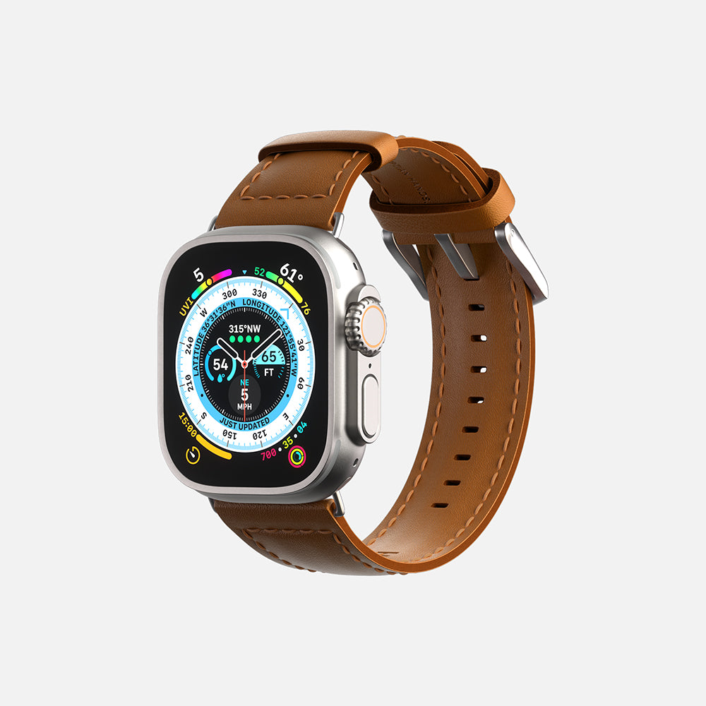 Modern Apple smartwatch with a brown leather strap and colorful display showing various metrics.