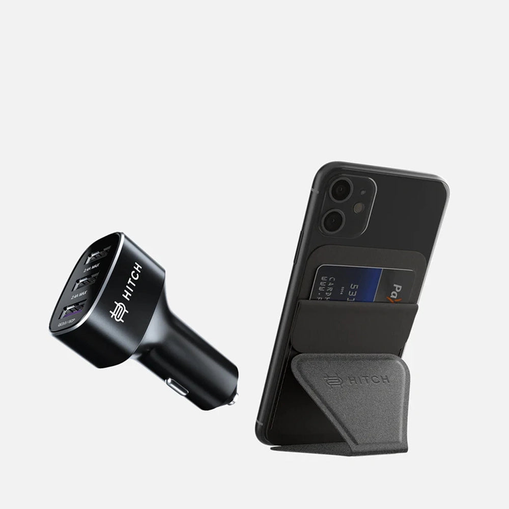 Black car charger and smartphone with invisible mobile stand on a white background.