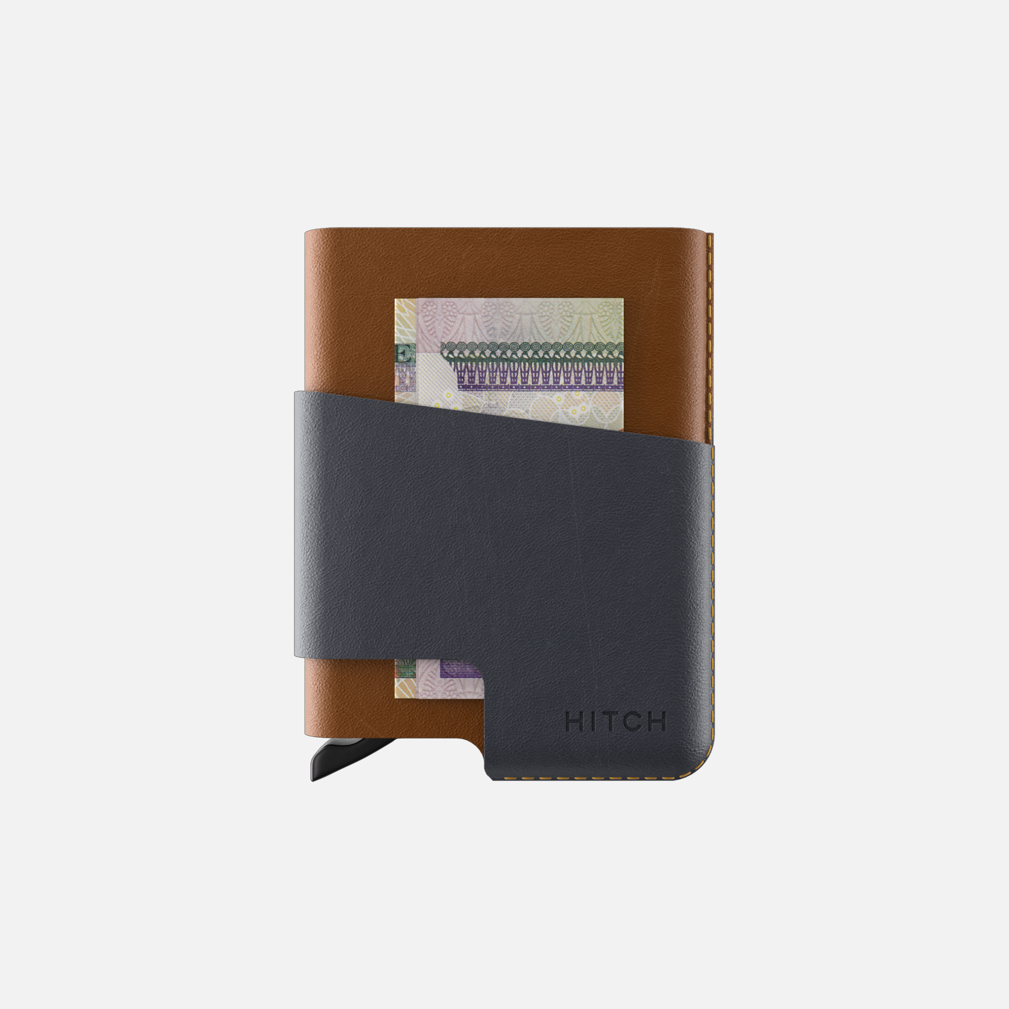 Brown and black leather cardholder wallet with money tucked inside, isolated on white background.