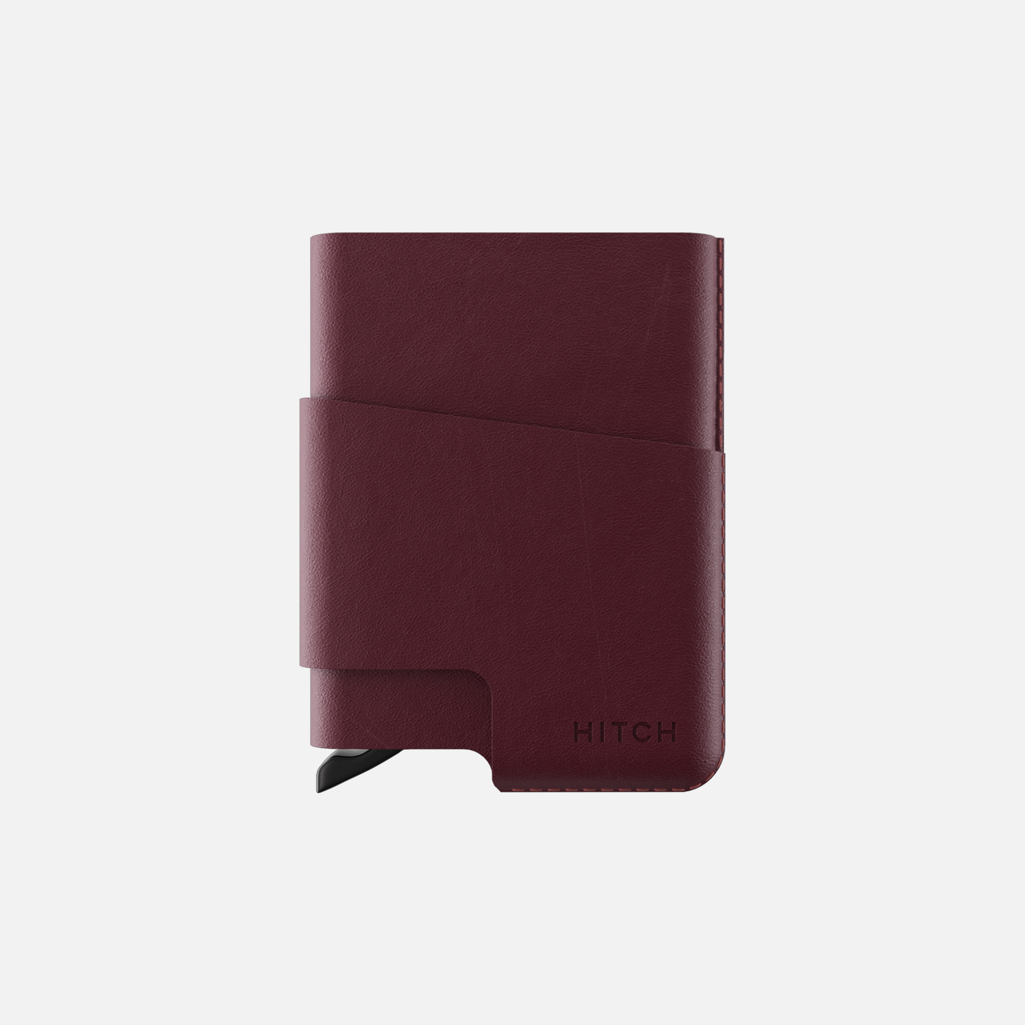 Burgundy leather cardholder wallet isolated on a white background.