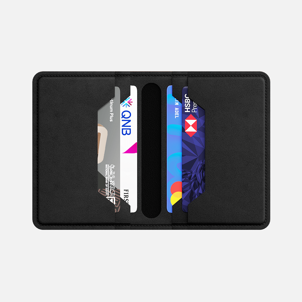 Black bifold wallet holding multiple credit cards with visible bank logos.