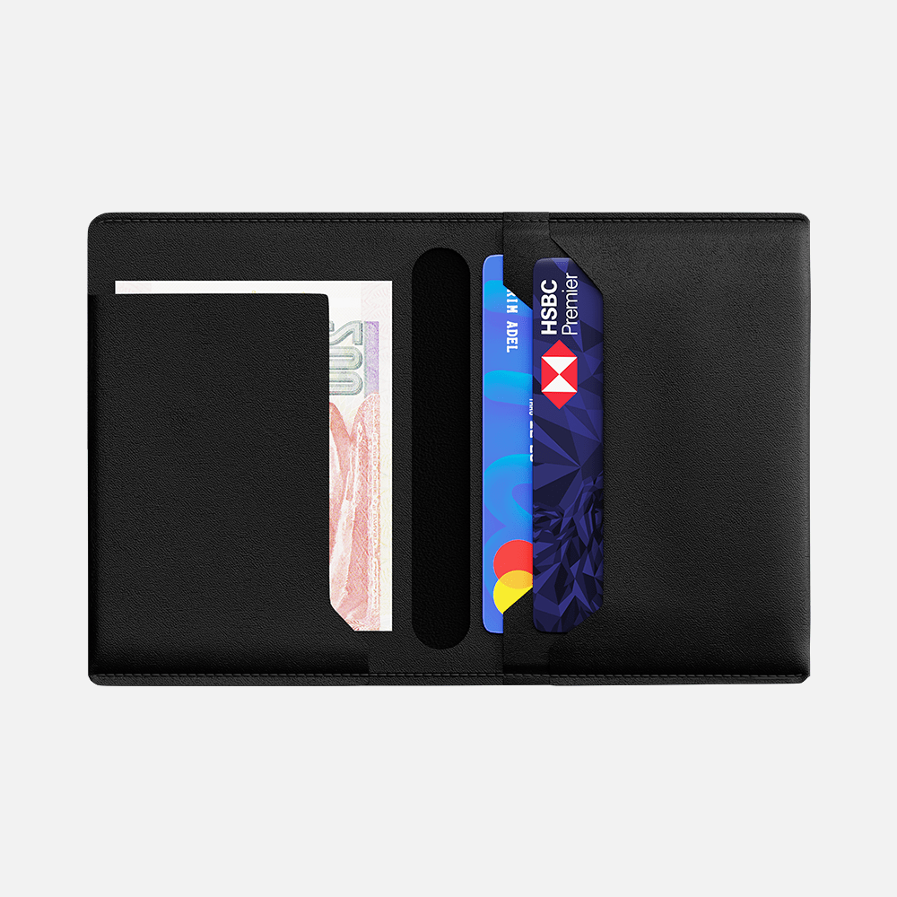 Black leather bifold wallet with credit cards and cash visible on white background.