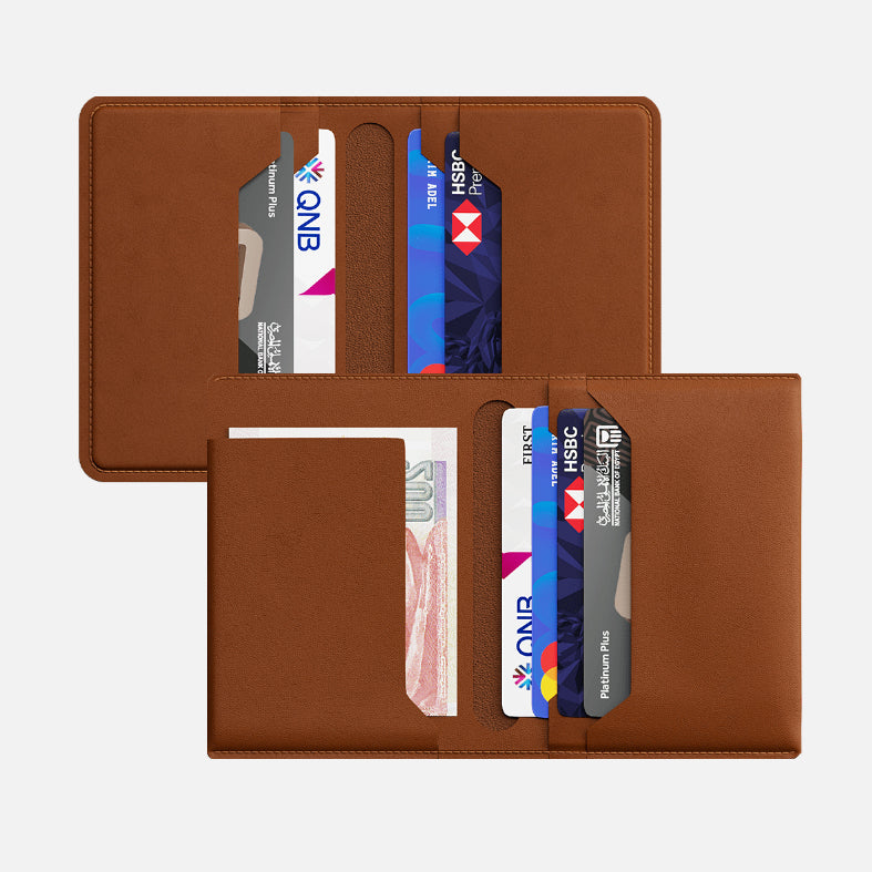 Brown leather bifold wallet with credit cards and cash visible in slots, isolated on a white background.