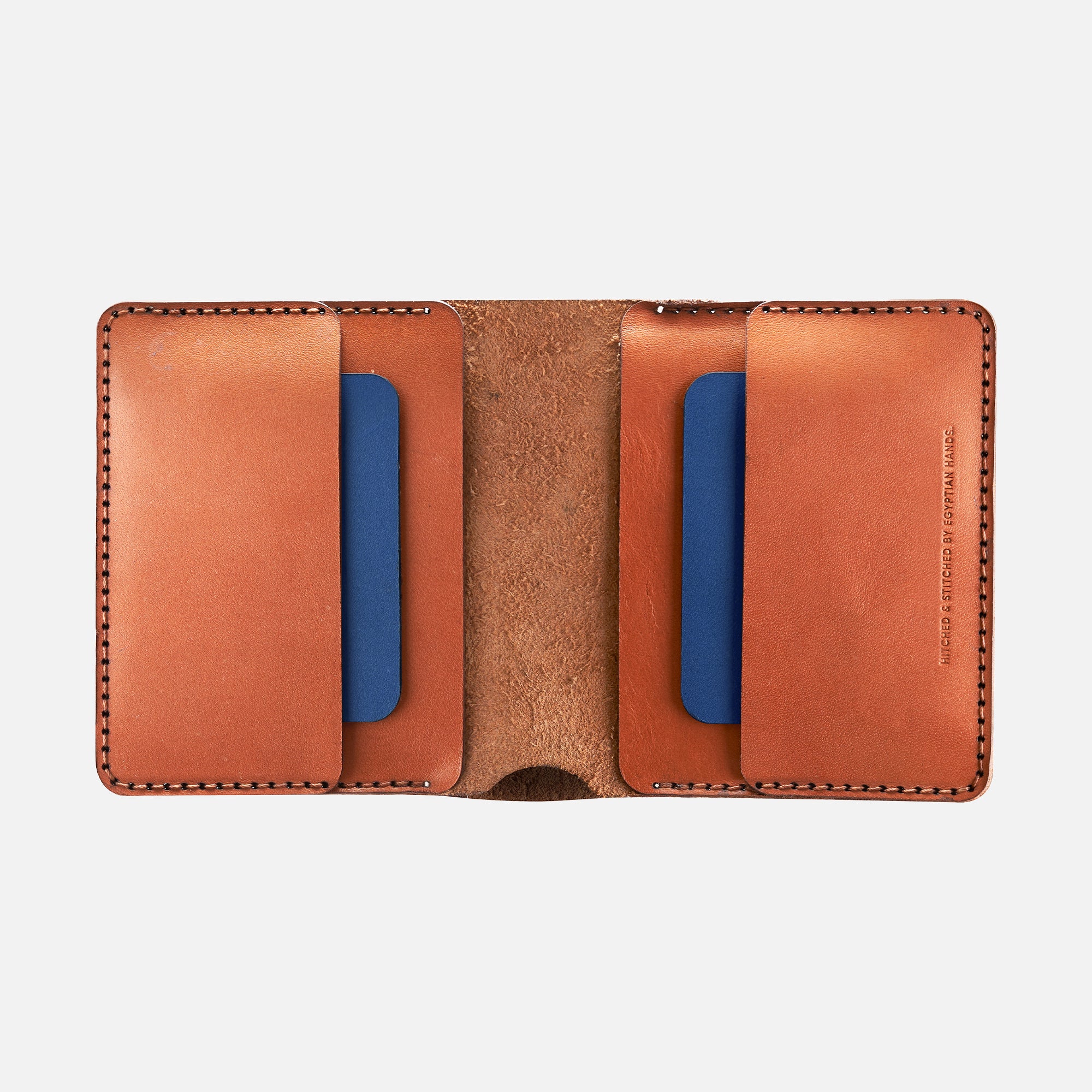 Brown leather bifold wallet open flat showing blue card slots and stitched edges.