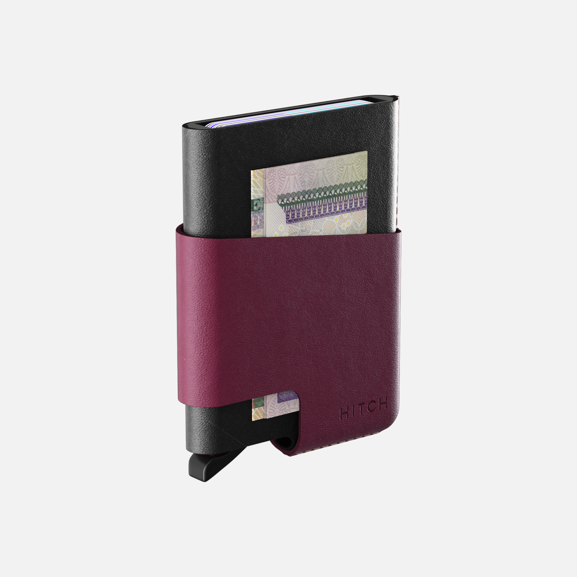 Minimalist black and burgundy leather wallet with money clip and card storage on white background."