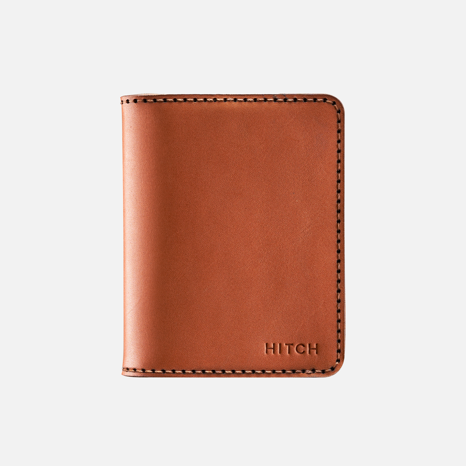 Brown leather bifold wallet with embossed "HITCH" logo and contrast stitching isolated on white background.