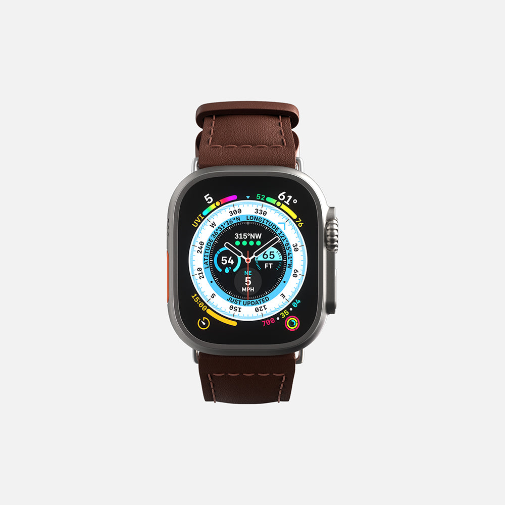Apple Smartwatch with brown leather strap and colorful digital display on white background.