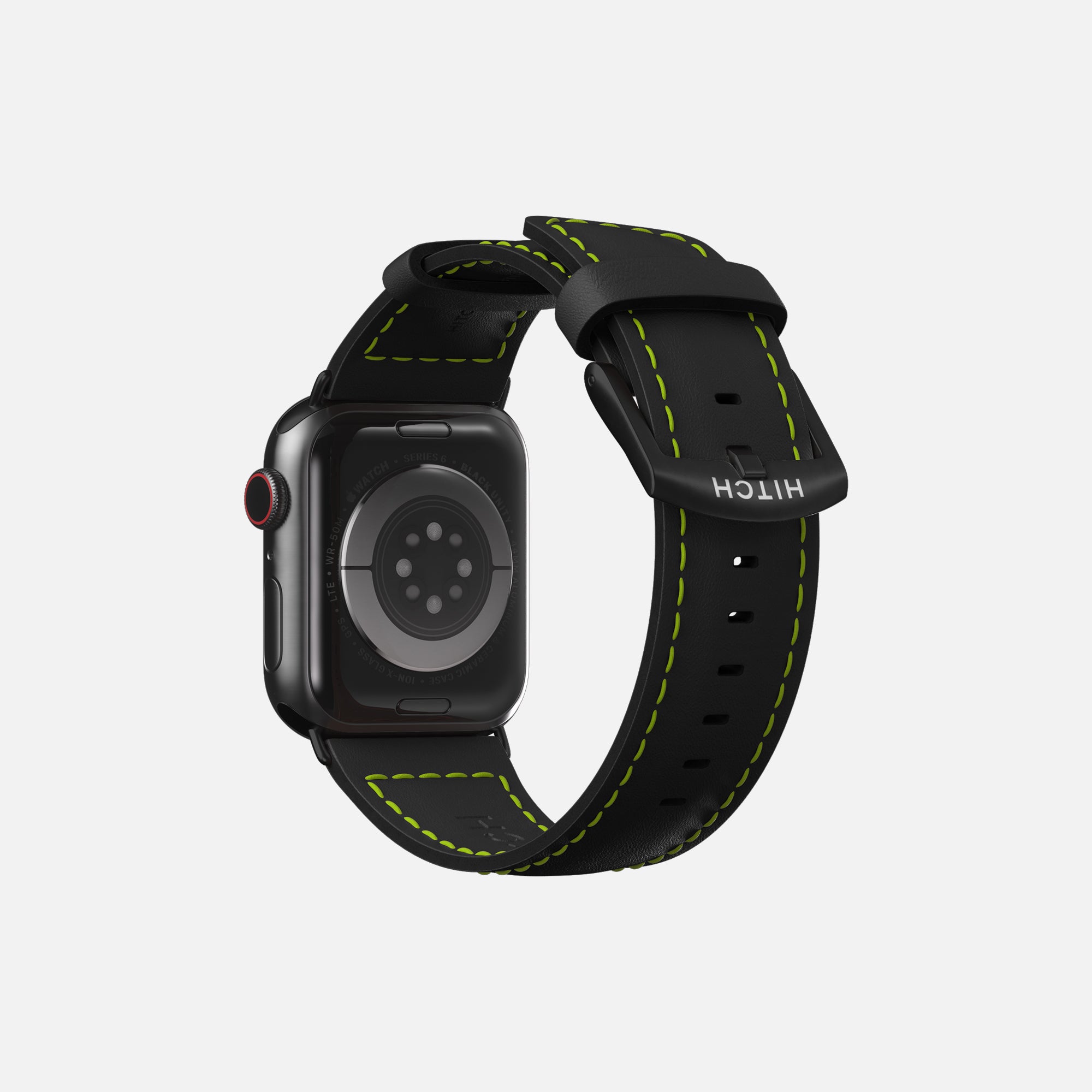 Apple smartwatch with black leather strap and green stitching on a white background.