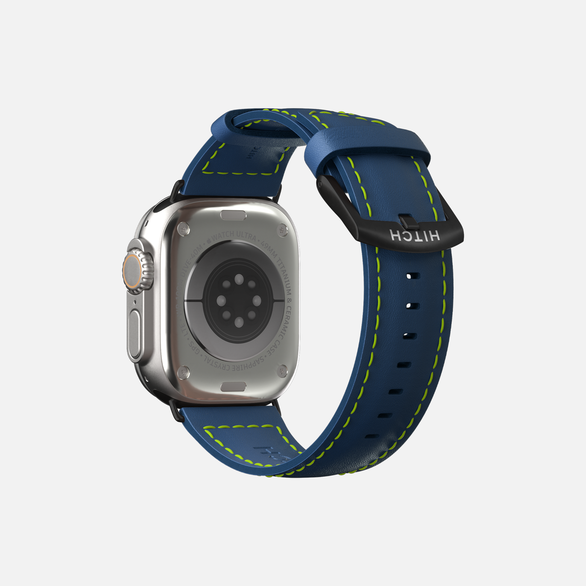 Rear view of a silver Apple smartwatch with blue and neon green sport band on white background.