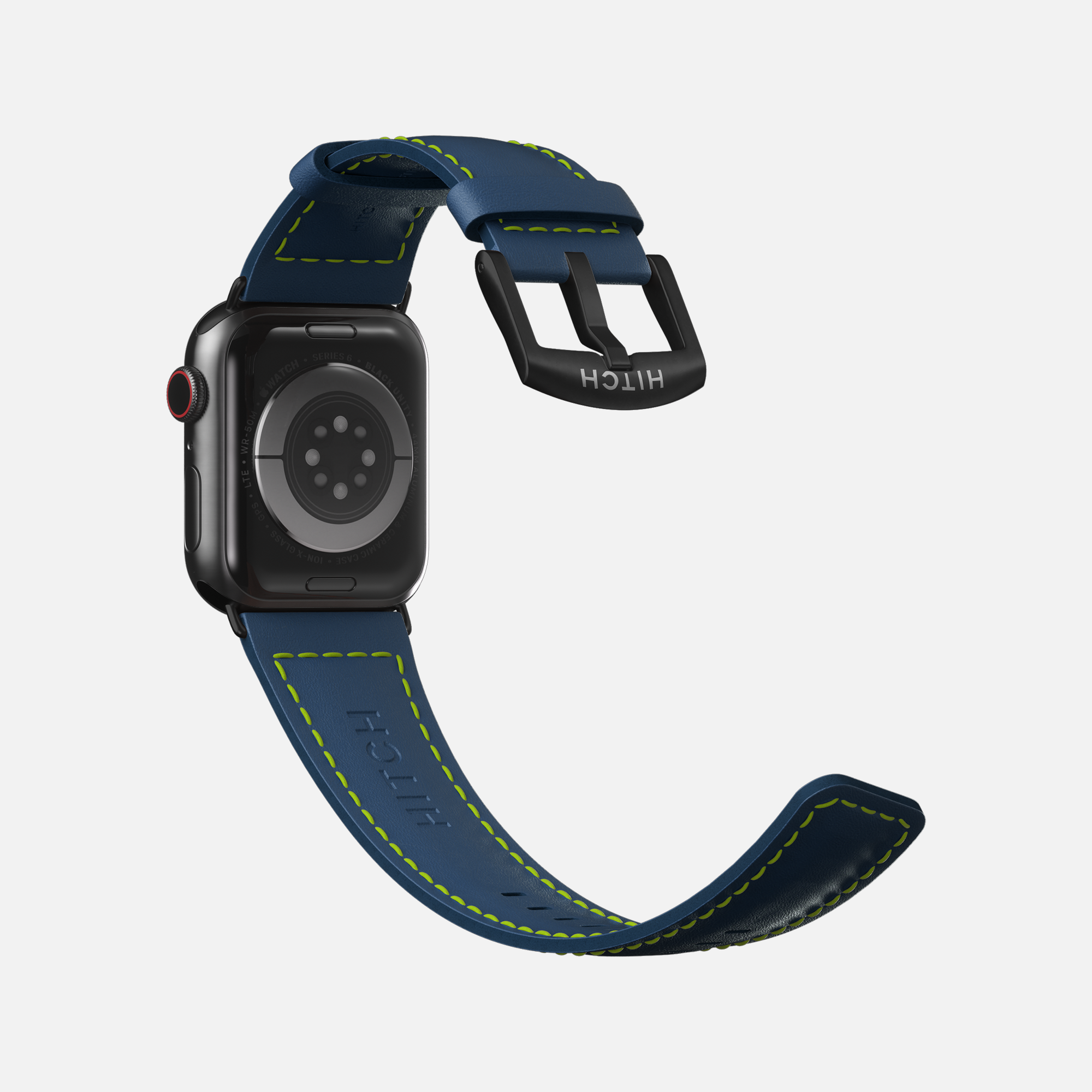 Apple  smartwatch with contrasting green stitching and navy blue leather strap design on a white background.