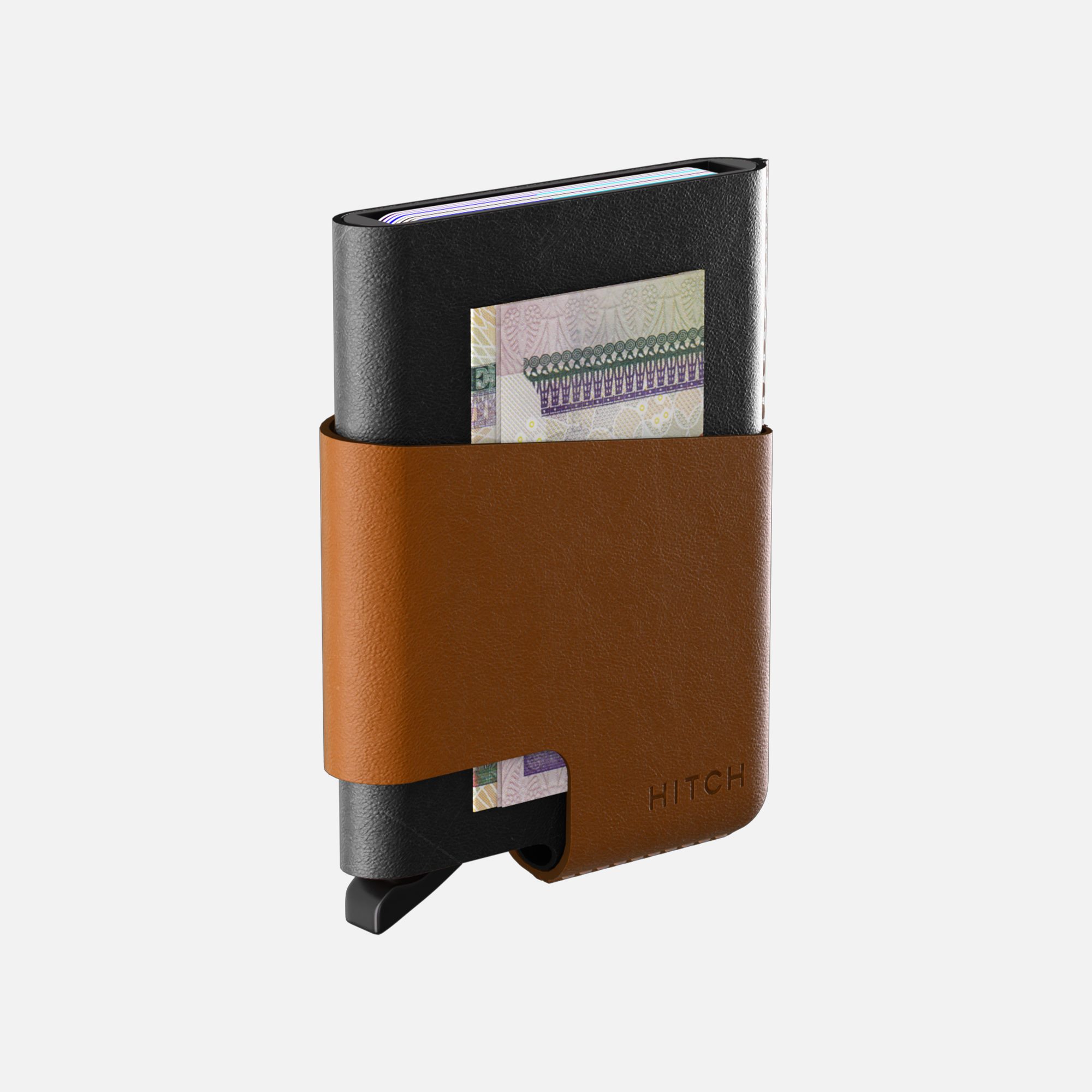Black and brown leather wallet with money clip and cash on white background.