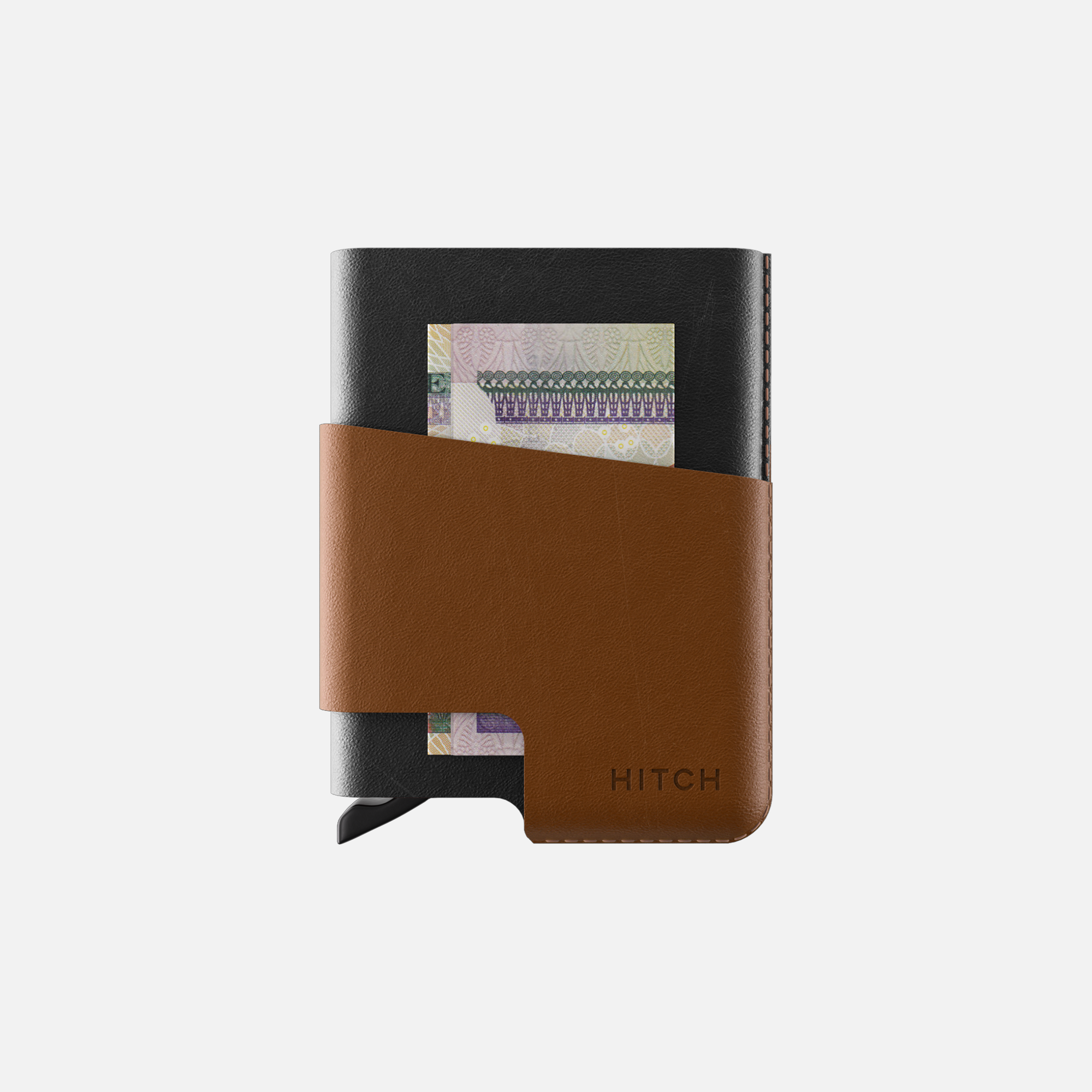 Black and brown leather notebook with partial currency note visible, branded HITCH".
